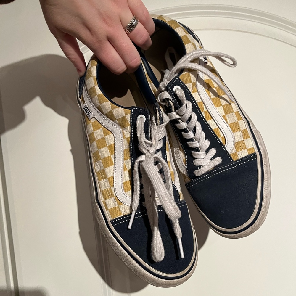 Blue, yellow, and white Vans